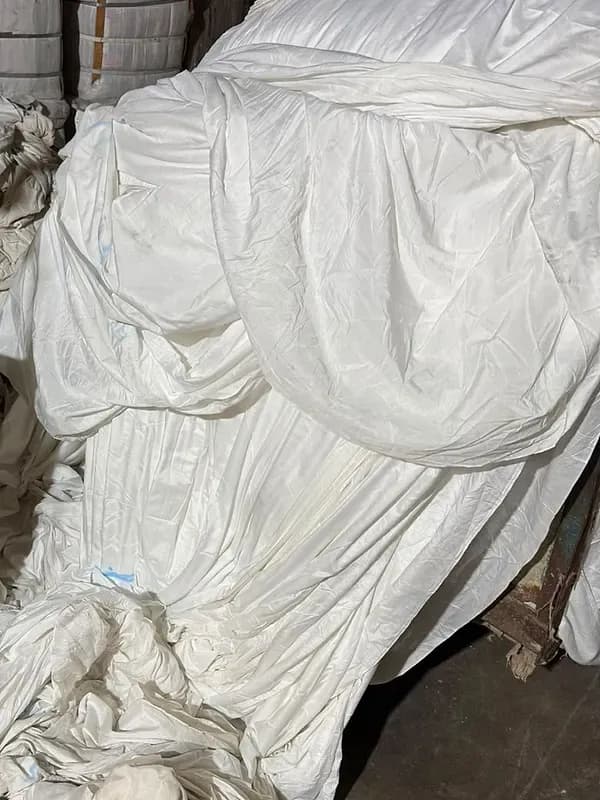 Folds of raw white cloth
