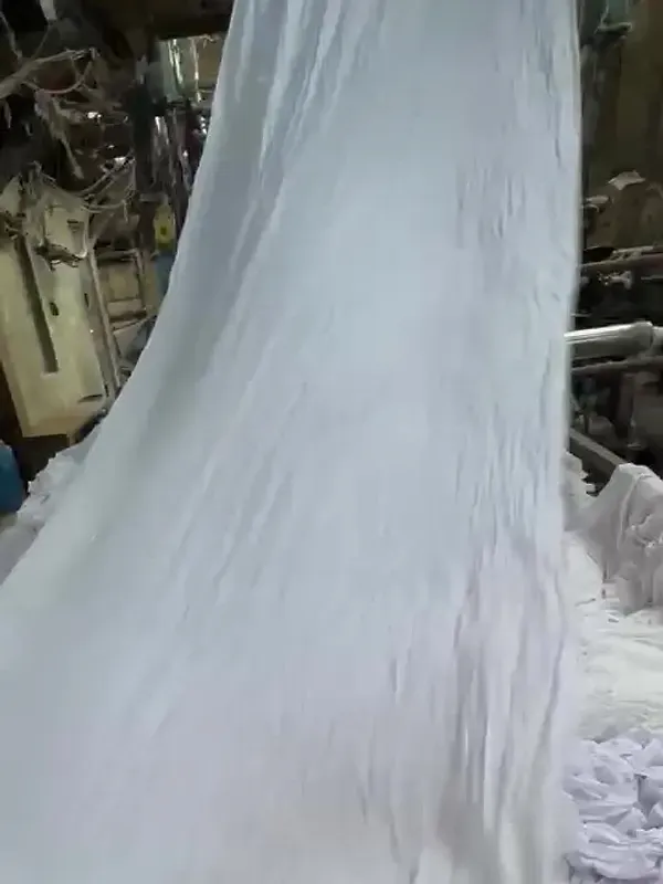 White cloth cascading off the rollers